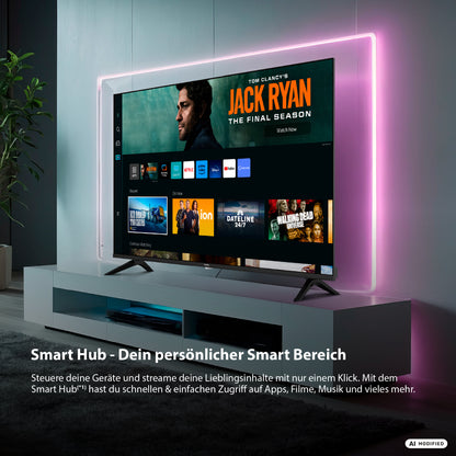 Ein DYON Ultimax 40F-TI-W, ein 40-Zoll-Full-HD-Smart-TV von Samsung mit Tizen-Betriebssystem, steht auf einem weißen Sockel; auf seinem Bildschirm wird ein Streaming-Menü mit verschiedenen Serien und Filmen angezeigt. Rosa LED-Leuchten umrahmen den Fernseher. Deutscher Text hebt die Funktionen des Smart Hubs hervor, wobei der Schwerpunkt auf dem Tizen-Betriebssystem und den Möglichkeiten des Samsung Gaming Hubs liegt.