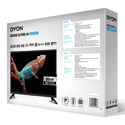 Auf der Verpackung des Dyon Enter 32 Pro X2 32-Zoll-HD-Fernsehers (gebraucht) ist eine farbenfrohe Eidechse auf dem Bildschirm abgebildet. Auf der Verpackung sind wichtige Details, Anschlüsse und technische Daten sowohl auf Deutsch als auch auf Englisch gut sichtbar angegeben. Dieser 32-Zoll-HD-LED-Fernseher der Marke Dyon ist deutlich dargestellt, sodass er leicht zu erkennen ist, wenn Sie nach einem gebrauchten Fernseher suchen.