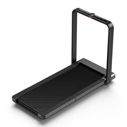 Das Kingsmith WalkingPad X21, ein schwarzes, klappbares Laufband mit schlankem Rahmen, aufrechter Handlaufstange und oben angebrachtem Bedienfeld, ist vor einem weißen Hintergrund abgebildet.