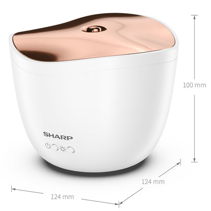 Der Sharp Ultraschall Aroma Zerstaeuber in Weiß und Roségold, 100 mm hoch und 124 mm breit, hat Fronttasten und Kontrollleuchten - ideal für ätherische Öle.