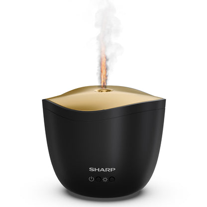 Der Sharp Ultraschall Aroma Zerstaeuber von Sharp ist ein schwarz-goldener Luftbefeuchter, der auch als Aroma-Diffusor funktioniert und sichtbaren Nebel von oben abgibt. Auf der Vorderseite befinden sich drei Bediensymbole.